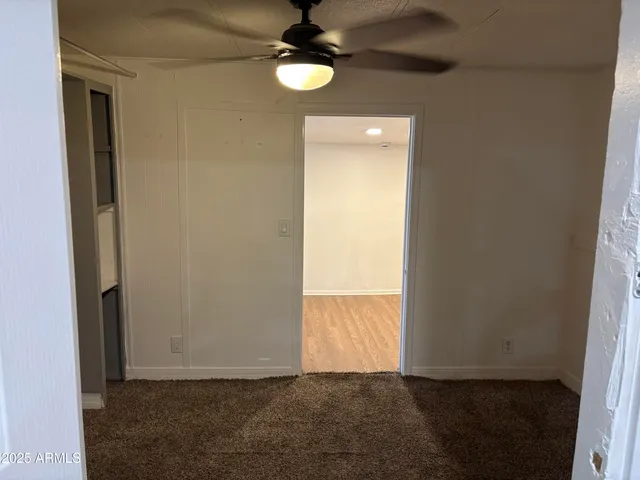 an empty room with closet area