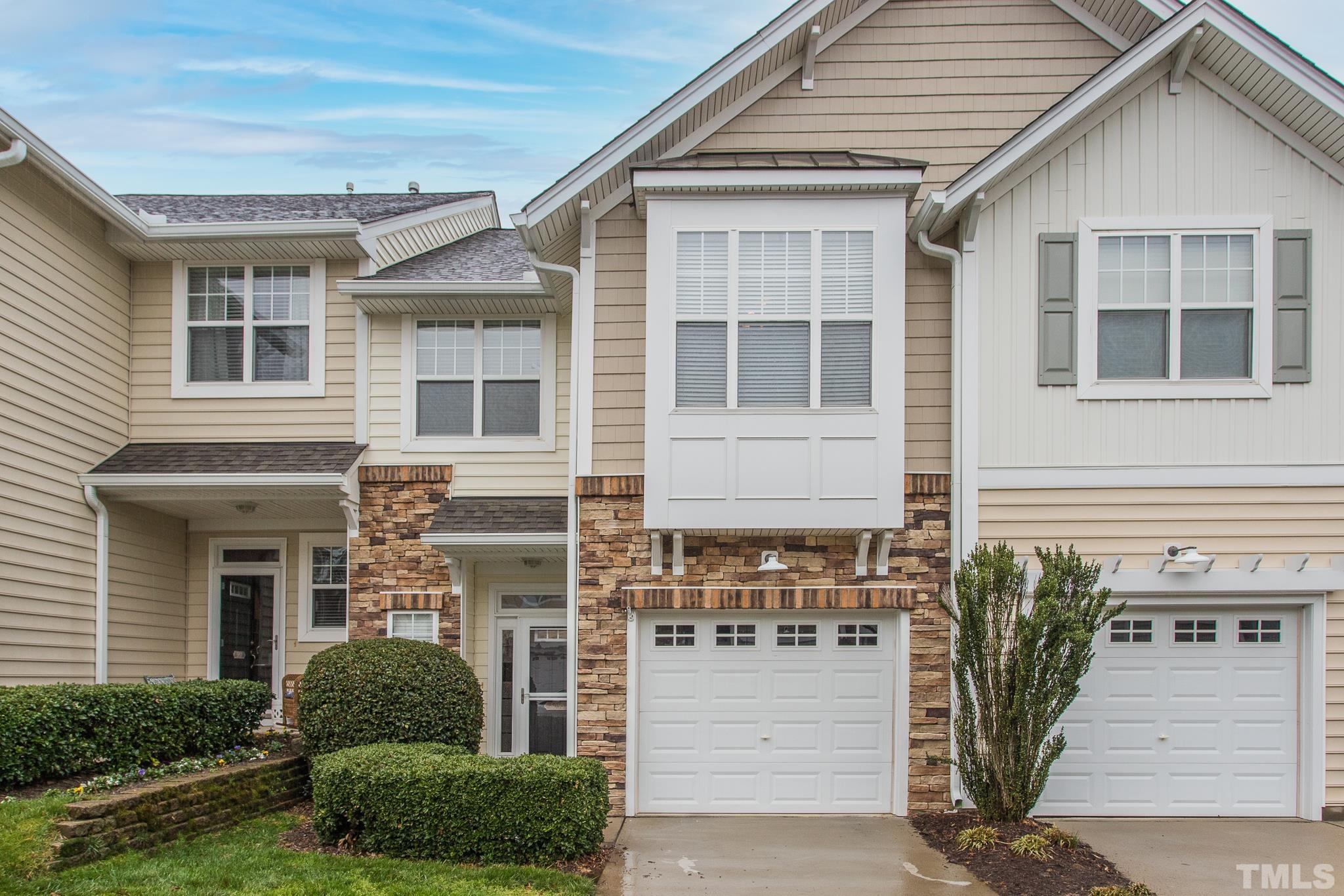 5050 Amber Clay Lane Raleigh, NC 27612 - Photo 1 of 23 a front view of a house with a yard