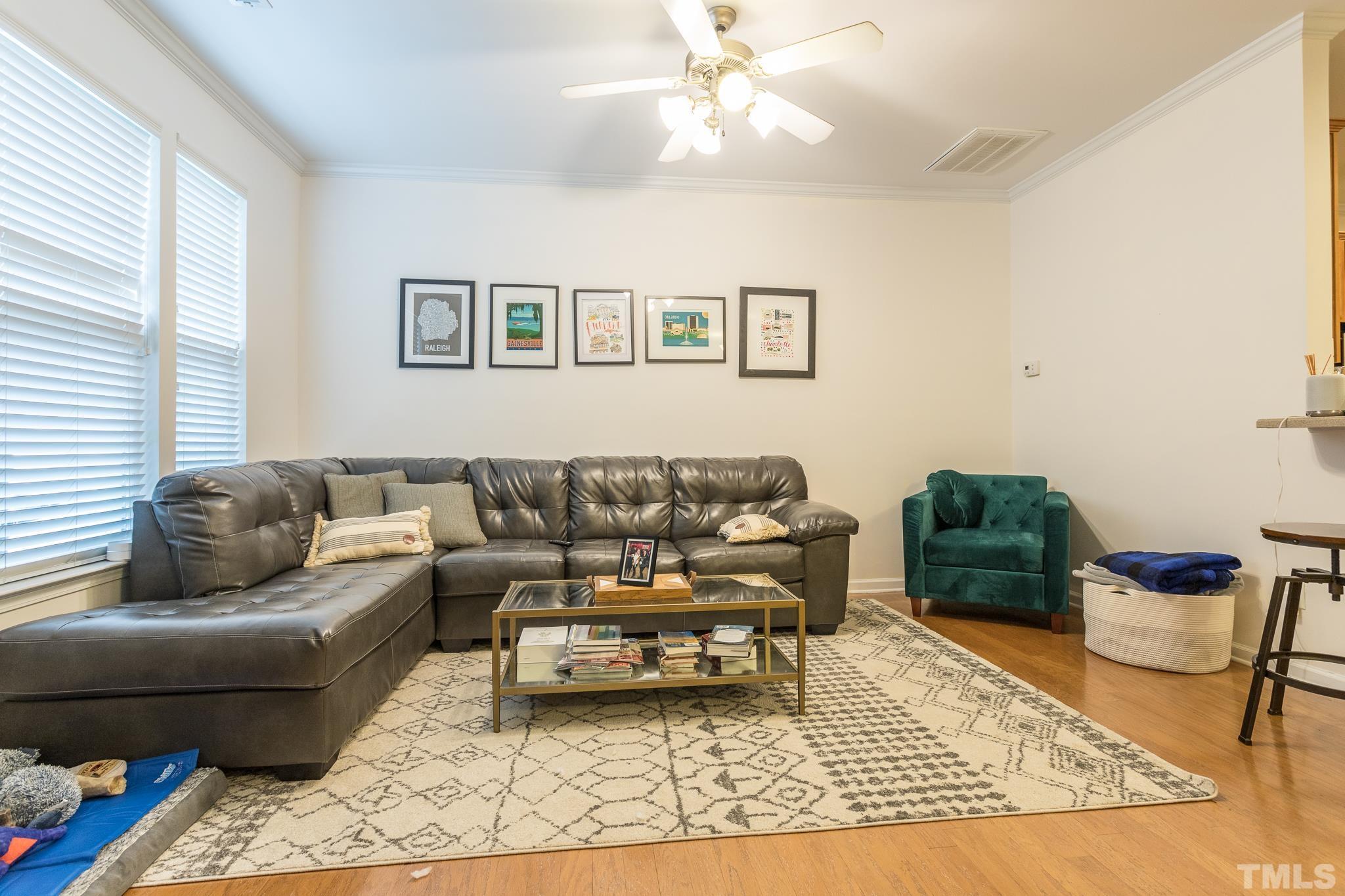 5050 Amber Clay Lane Raleigh, NC 27612 - Photo 13 of 23 a living room with furniture and a rug
