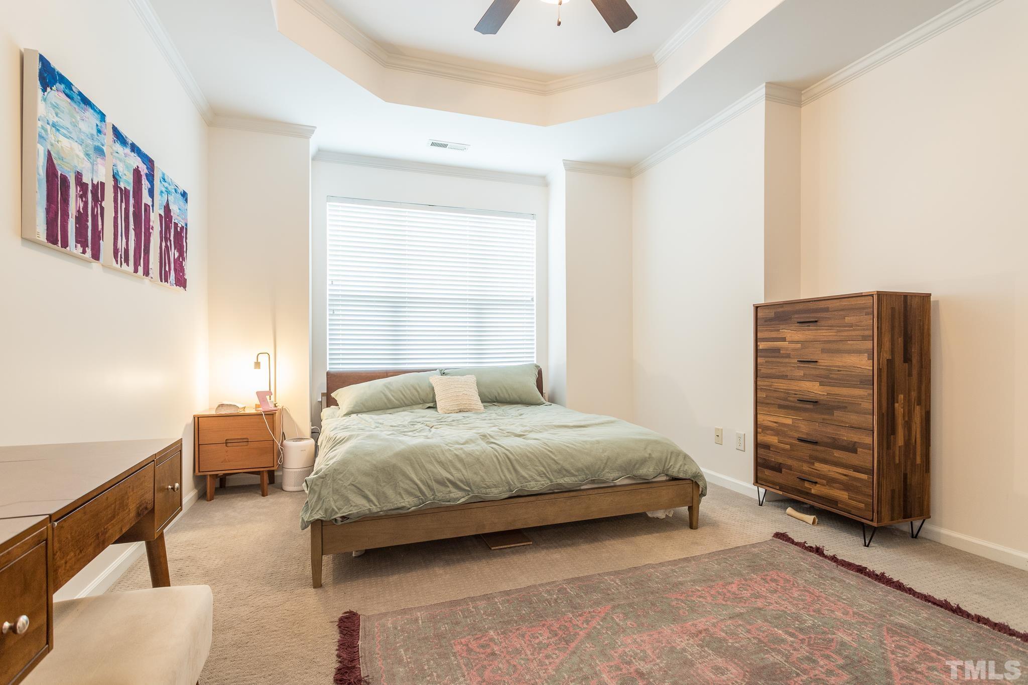 5050 Amber Clay Lane Raleigh, NC 27612 - Photo 15 of 23 a bedroom with a bed and a window