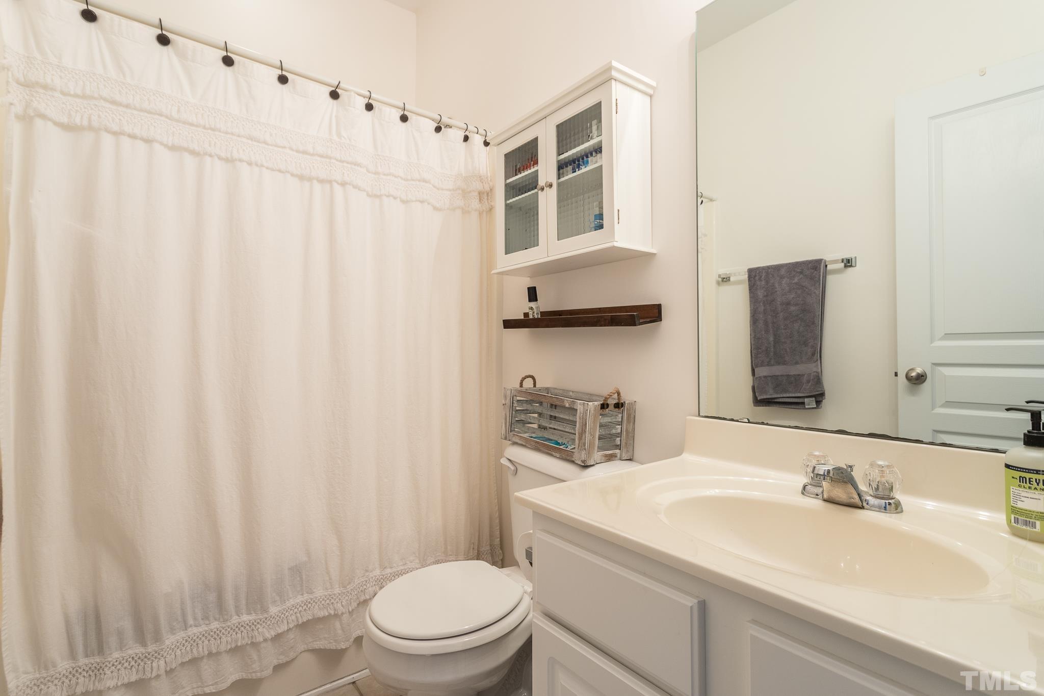 5050 Amber Clay Lane Raleigh, NC 27612 - Photo 18 of 23 a bathroom with a sink toilet and shower