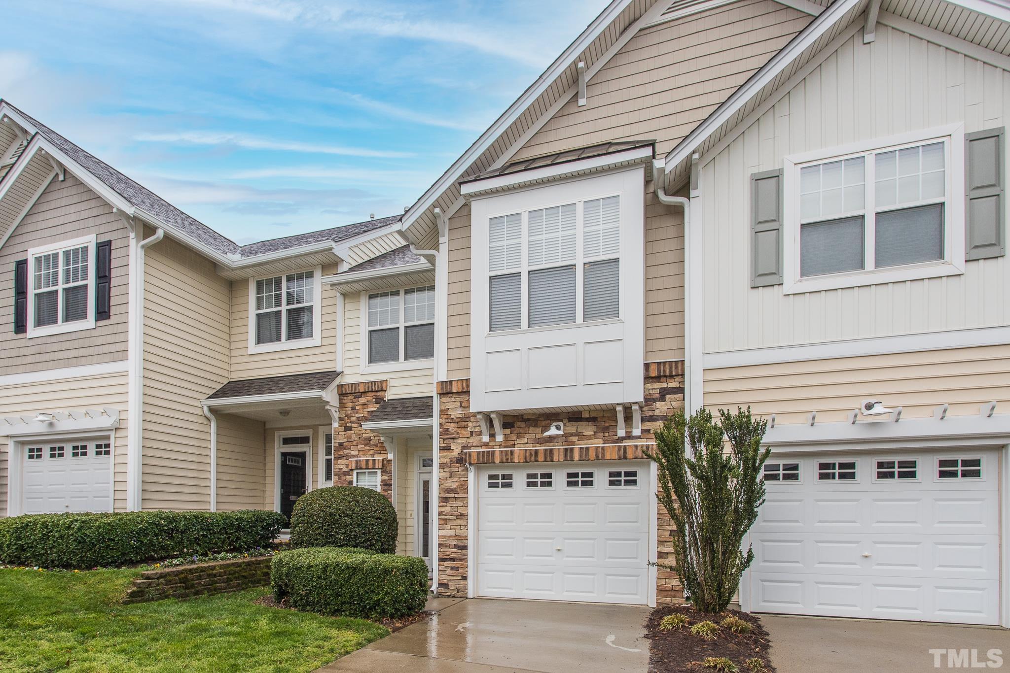 5050 Amber Clay Lane Raleigh, NC 27612 - Photo 2 of 23 a front view of a house with a yard