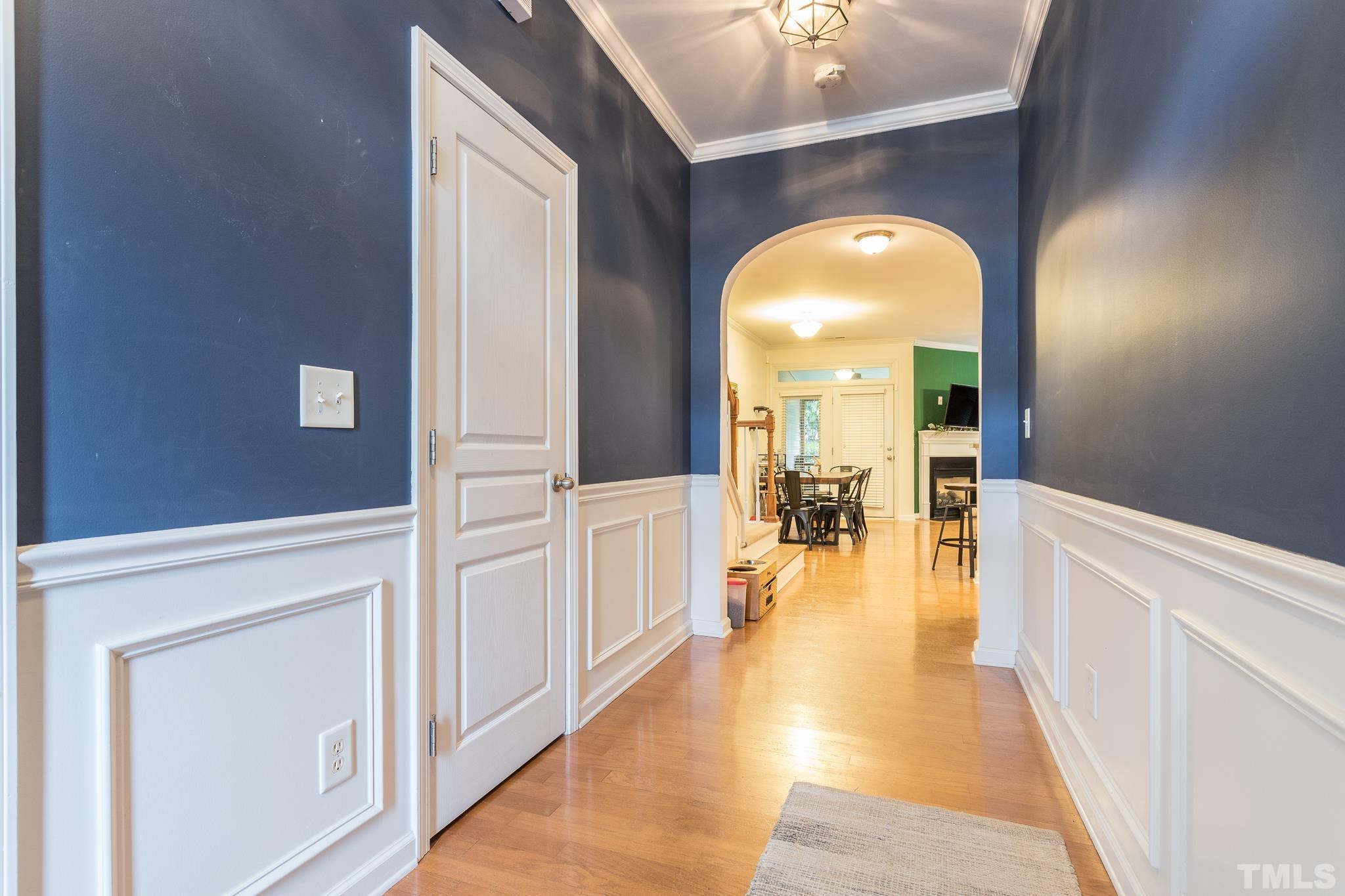 5050 Amber Clay Lane Raleigh, NC 27612 - Photo 6 of 23 a view of a living room with a fireplace wooden floor and a rug