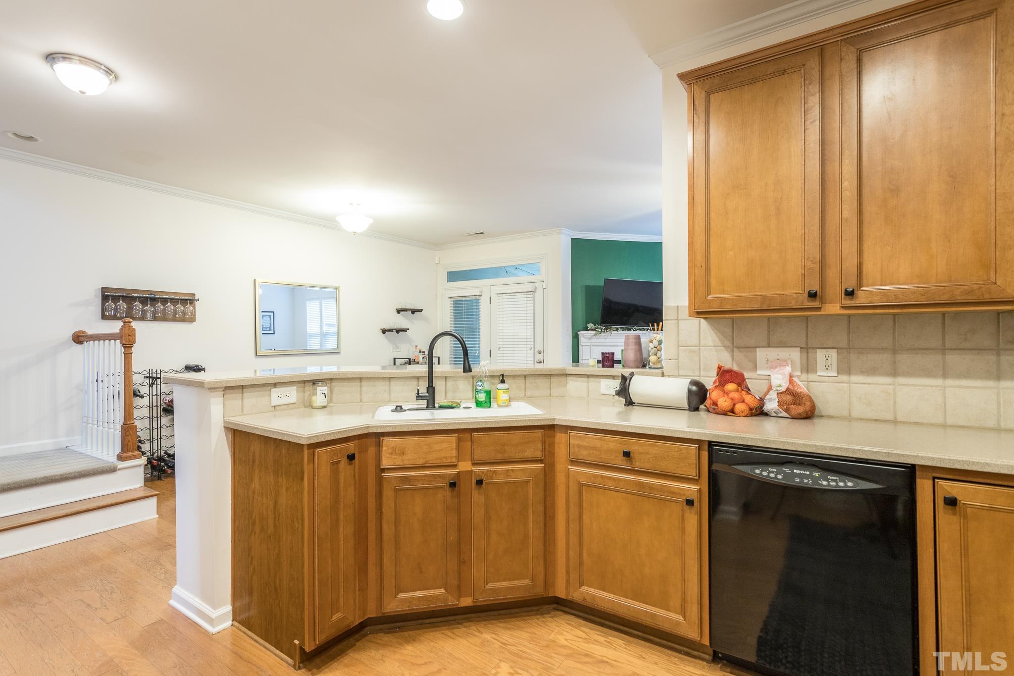5050 Amber Clay Lane Raleigh, NC 27612 - Photo 8 of 23 a kitchen with stainless steel appliances granite countertop a sink stove and cabinets