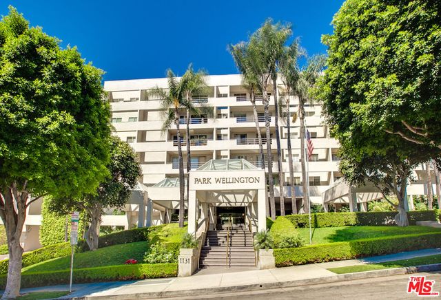 a view of a building with a garden