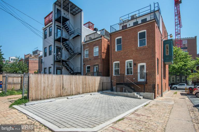 1102 5th Street Northwest, Unit 3 Washington, DC 20001 - Photo 11 of 11 a front view of a house with a yard