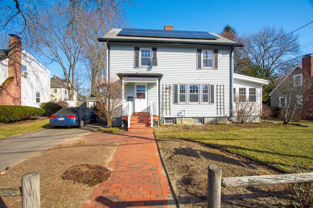 32 Emerson Road Needham, MA 02492 - Photo 1 of 27 a front view of a house with a yard