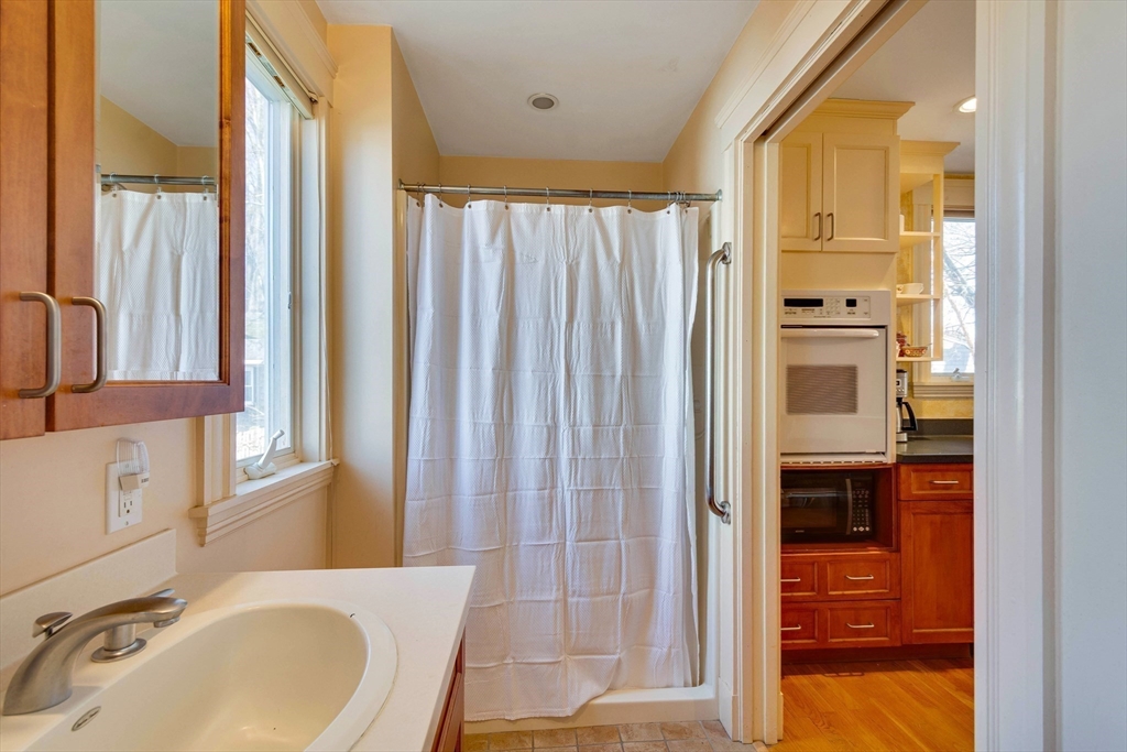 32 Emerson Road Needham, MA 02492 - Photo 14 of 27 a bathroom with a bathtub and a sink