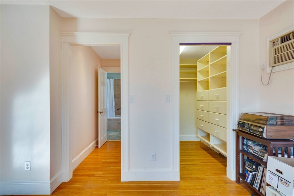 32 Emerson Road Needham, MA 02492 - Photo 18 of 27 a view of walk in closet with clothes and shoes