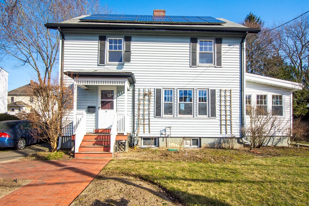 32 Emerson Road Needham, MA 02492 - Photo 2 of 27 a front view of a house with a yard