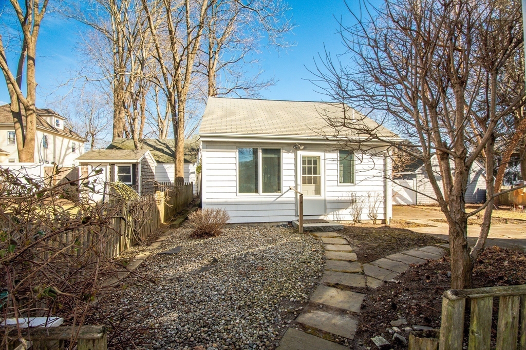 32 Emerson Road Needham, MA 02492 - Photo 23 of 27 a house with trees in the background