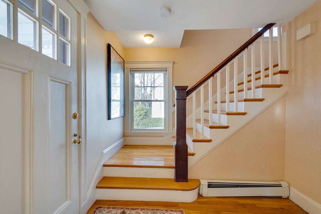 32 Emerson Road Needham, MA 02492 - Photo 3 of 27 a view of entryway with wooden floor and front door