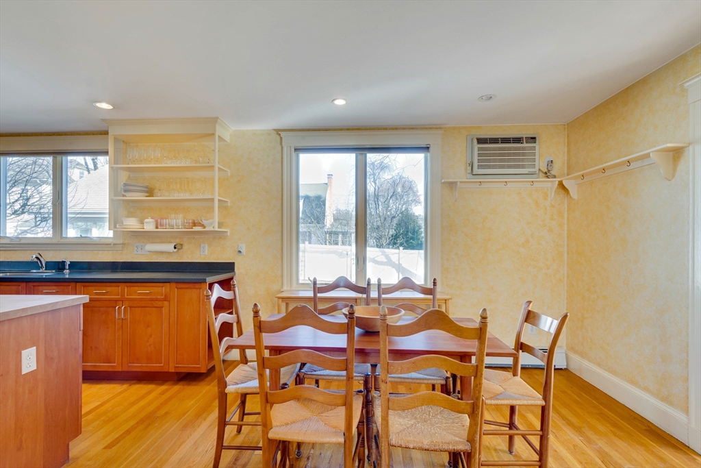 32 Emerson Road Needham, MA 02492 - Photo 8 of 27 a view of a dining room with furniture a chandelier and wooden floor