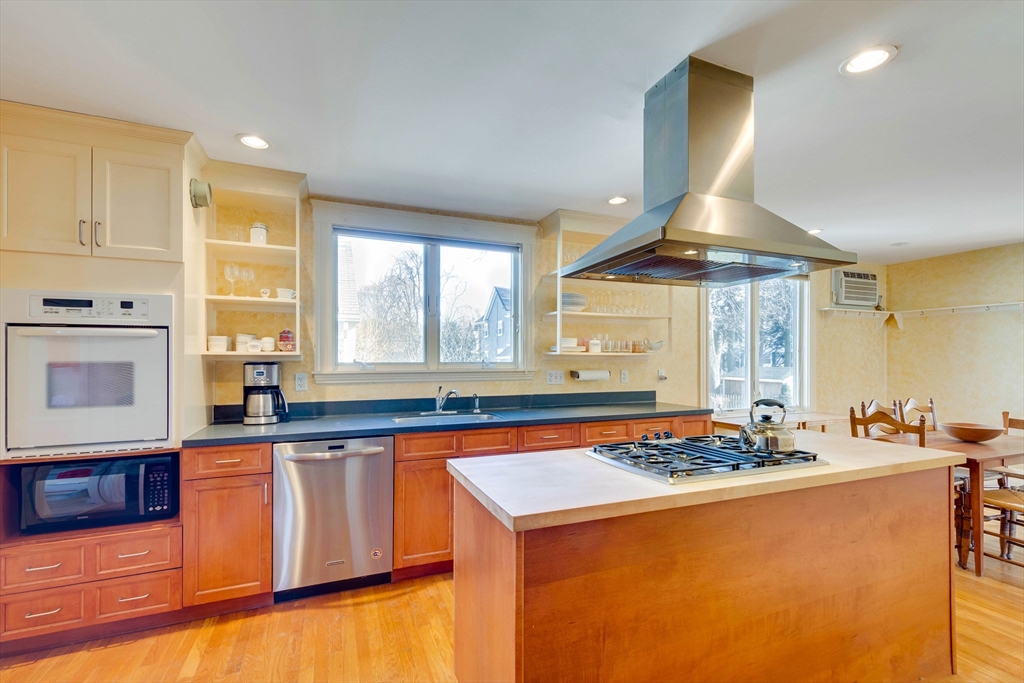32 Emerson Road Needham, MA 02492 - Photo 10 of 27 a kitchen with wooden cabinets and sink