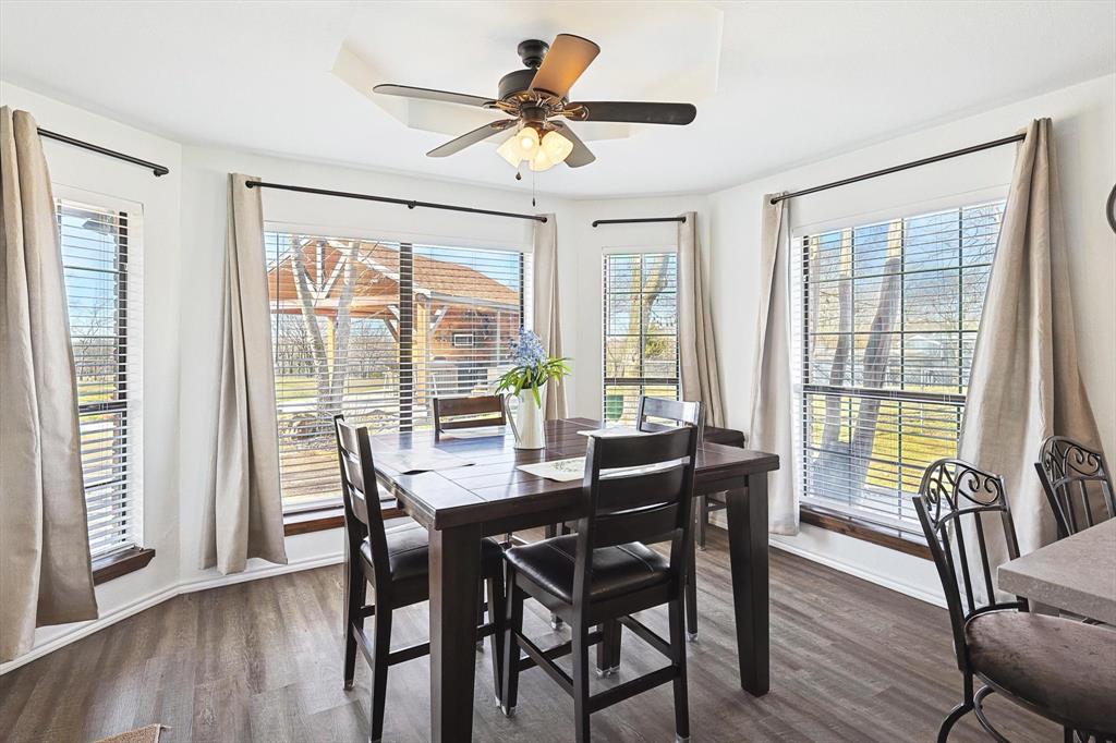 7185 Mesquite Ridge Sanger, TX 76266 - Photo 16 of 40 Dining space featuring ceiling fan and dark hardwood / wood-style floors