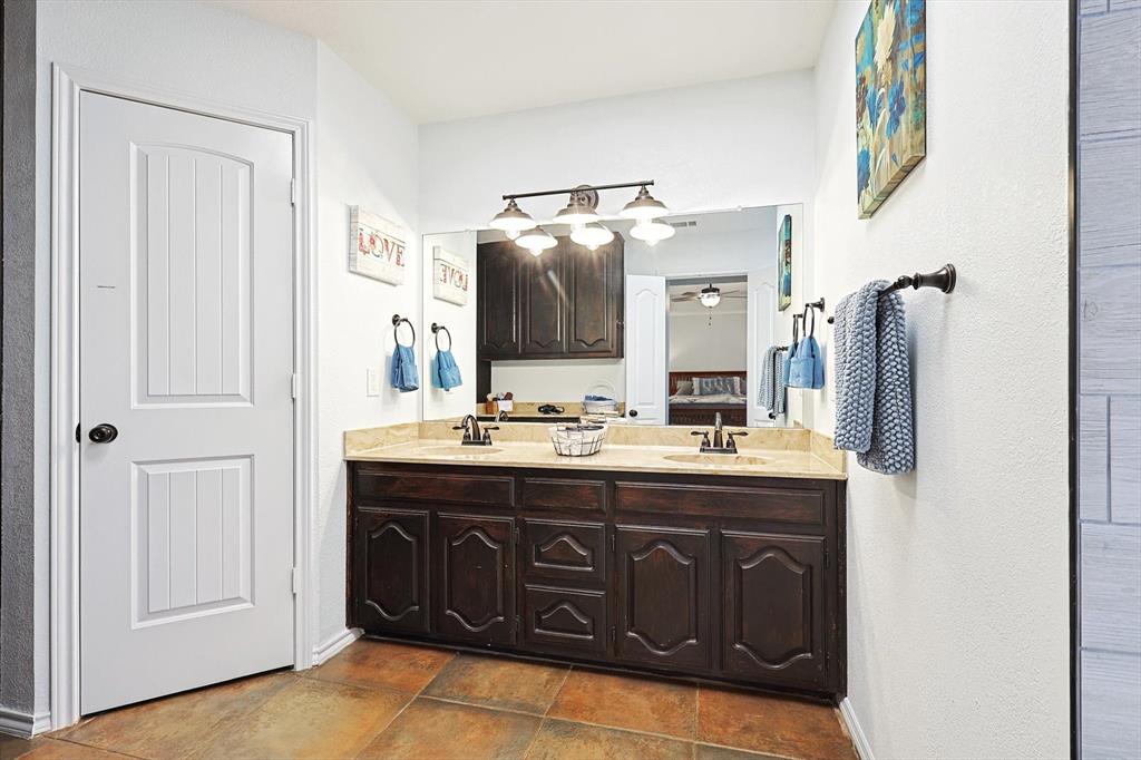7185 Mesquite Ridge Sanger, TX 76266 - Photo 19 of 40 Bathroom with ceiling fan and vanity