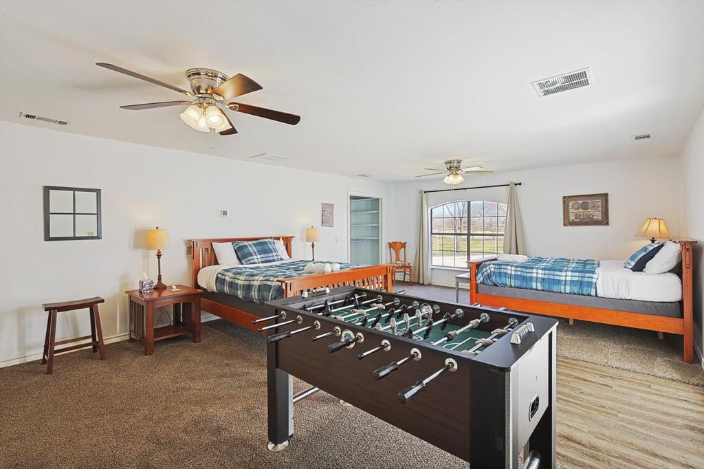 7185 Mesquite Ridge Sanger, TX 76266 - Photo 23 of 40 Bedroom with ceiling fan and carpet