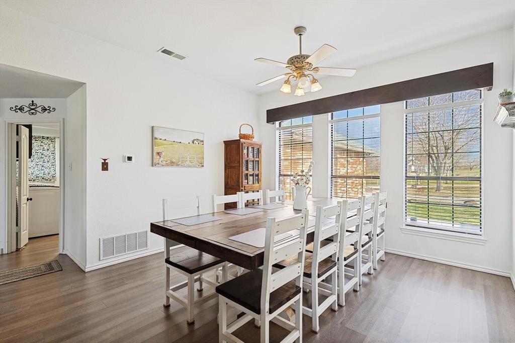 7185 Mesquite Ridge Sanger, TX 76266 - Photo 10 of 40 Dining area featuring ceiling fan and dark hardwood / wood-style flooring