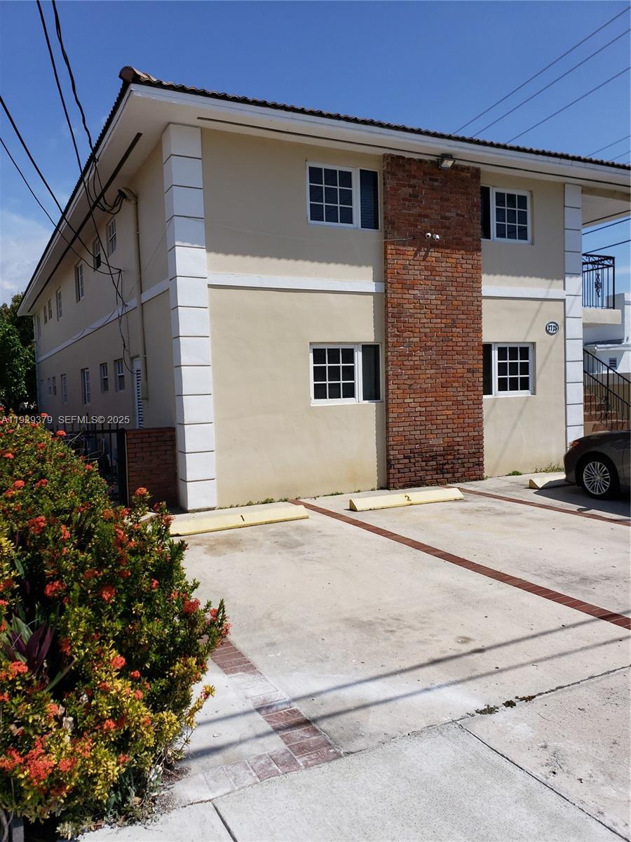 2725 Southwest 25th Street, Unit 4 Miami, FL 33133 - Photo 1 of 9 a view of a house with a street