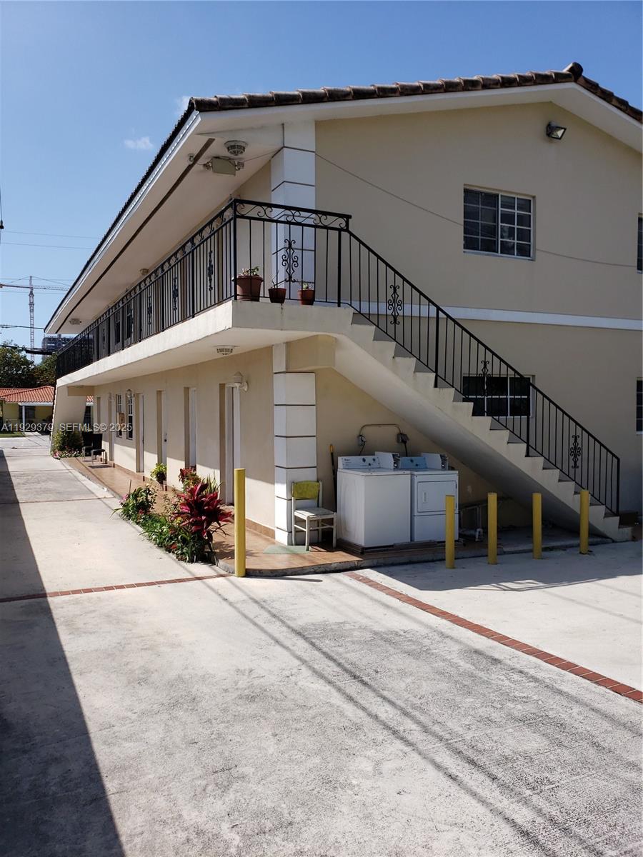 2725 Southwest 25th Street, Unit 4 Miami, FL 33133 - Photo 2 of 9 a view of a house with sitting area