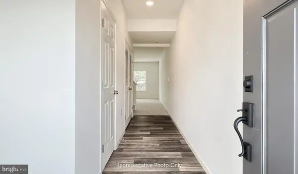 a view of a hallway with a white walls