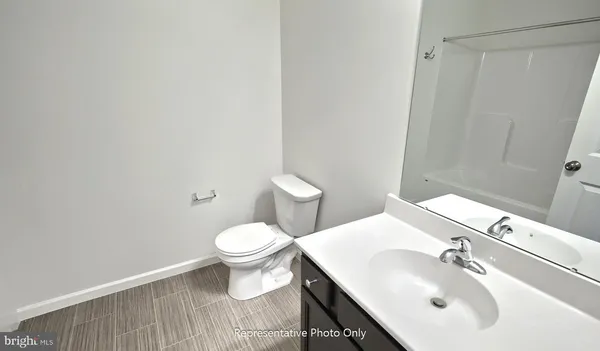 a bathroom with a sink toilet and vanity