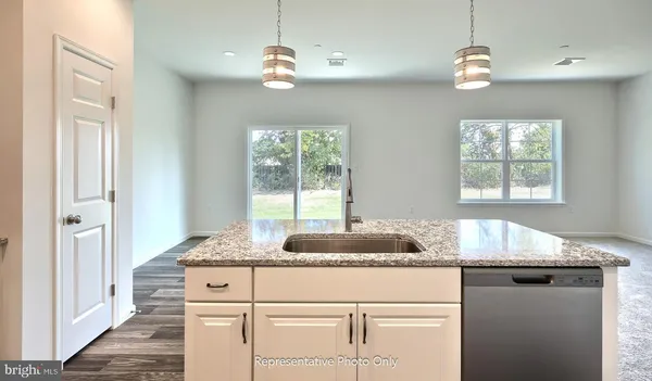 a bathroom with a granite countertop sink and a granite