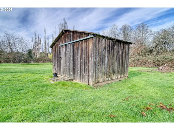 a backyard of a house with lots of green space