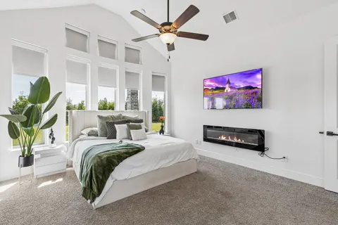 a living room with furniture and a pool table