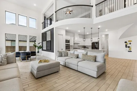 a room with furniture and a large window