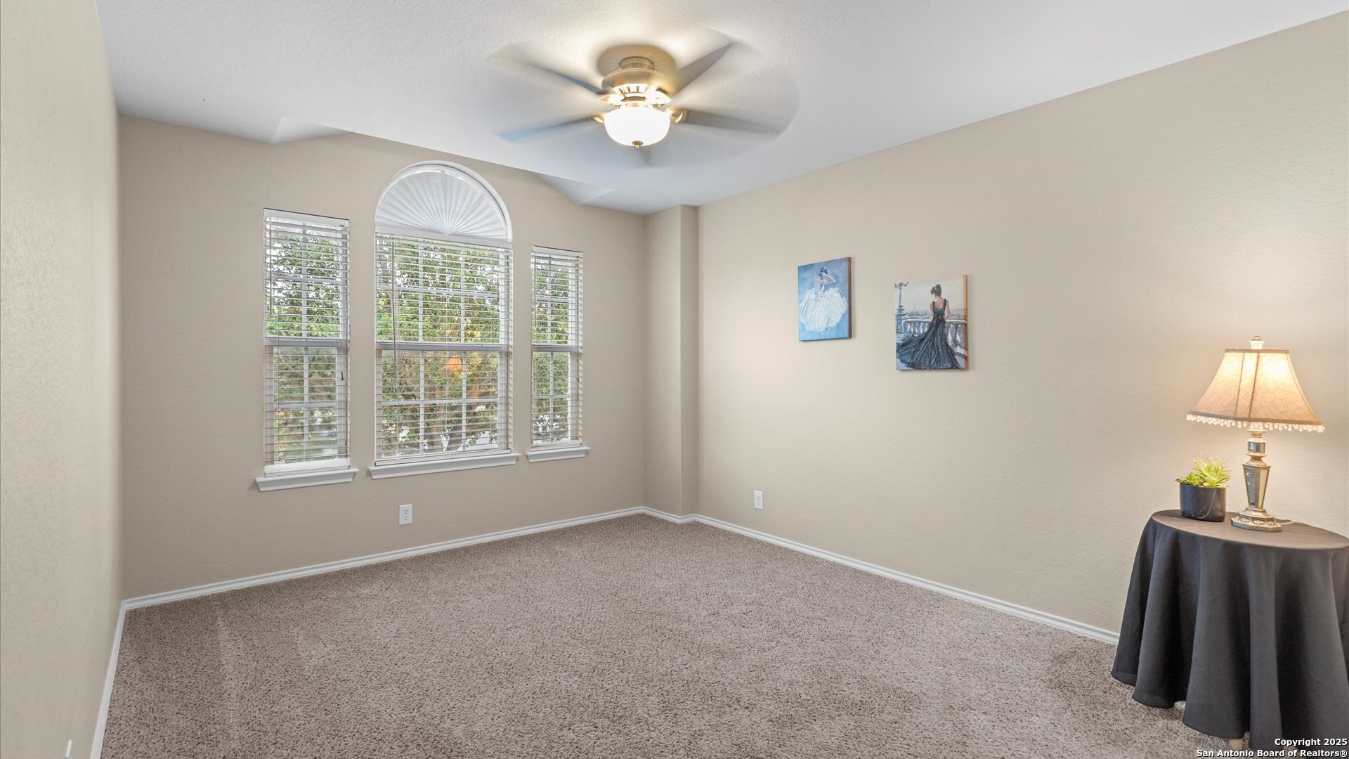 9009 Peridot Schertz, TX 78154 - Photo 15 of 28 a view of livingroom with furniture ceiling fan and a window