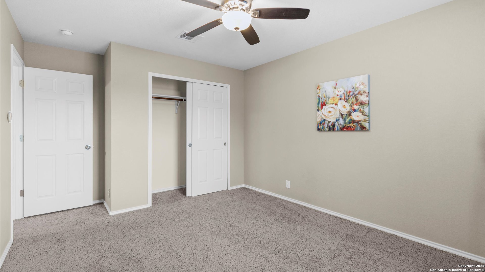 9009 Peridot Schertz, TX 78154 - Photo 17 of 28 an empty room with painting on the wall