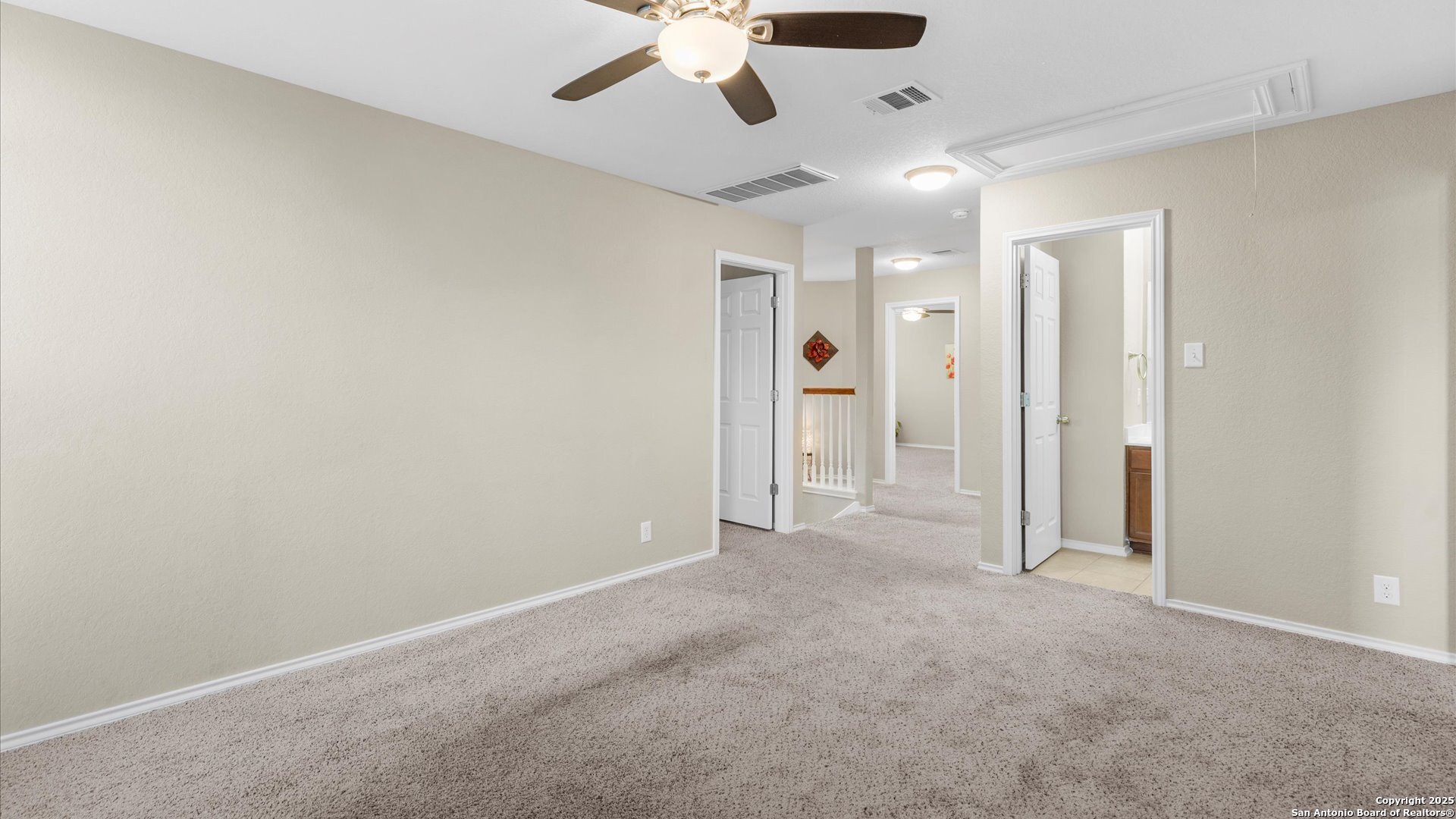 9009 Peridot Schertz, TX 78154 - Photo 18 of 28 en empty room with windows and fan