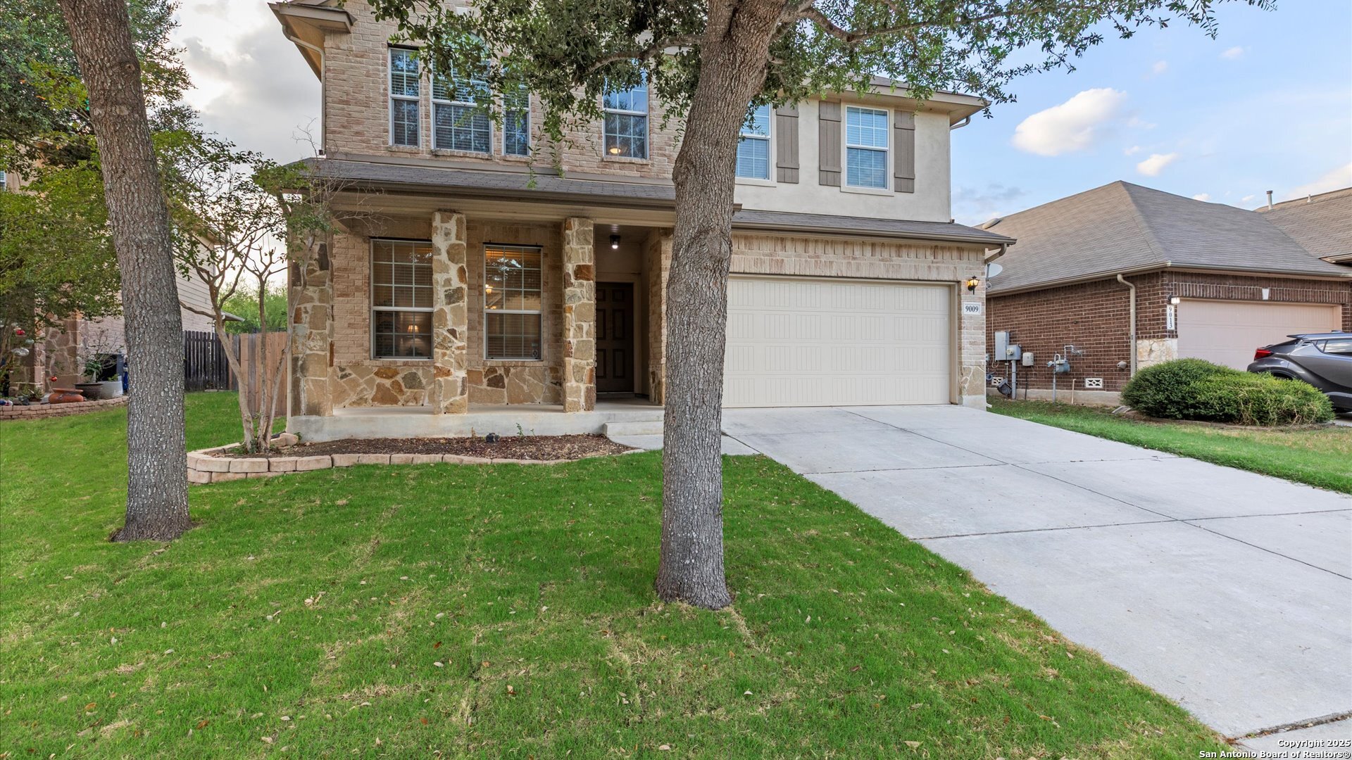 9009 Peridot Schertz, TX 78154 - Photo 2 of 28 front view of a house with a yard