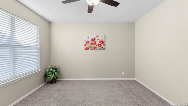 a view of an empty room and a bathroom