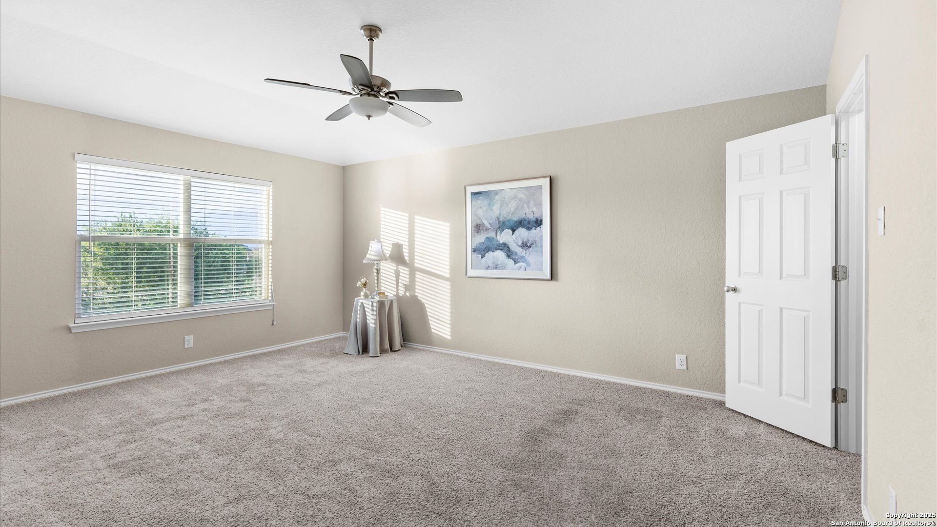 9009 Peridot Schertz, TX 78154 - Photo 22 of 28 a view of a livingroom with a ceiling fan and window