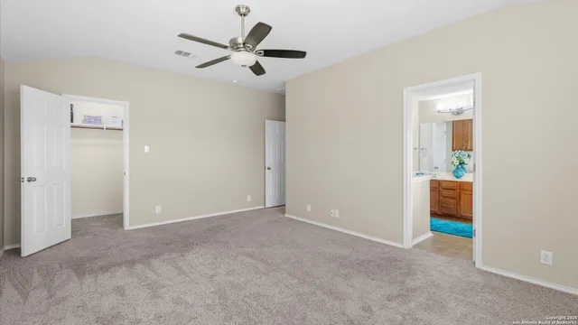 a bathroom with a tub shower and a sink
