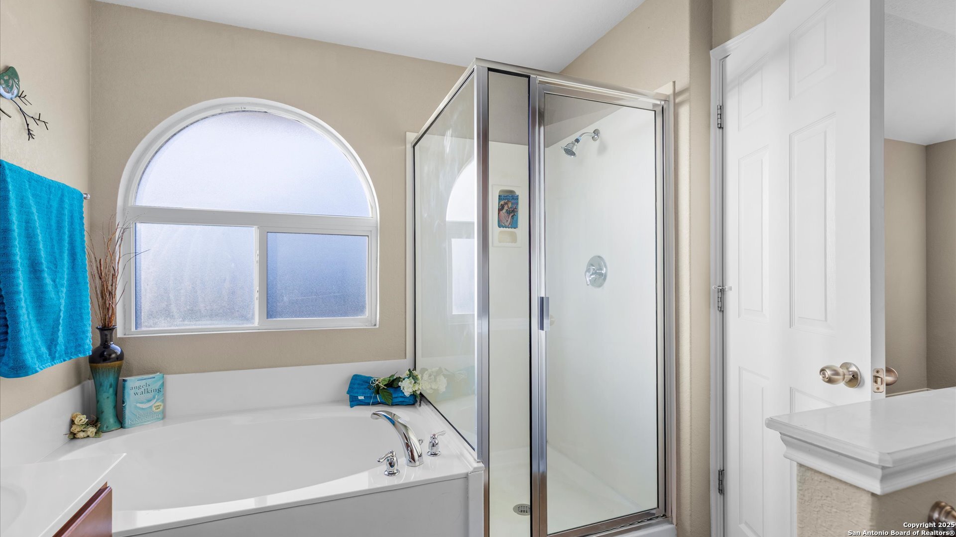 9009 Peridot Schertz, TX 78154 - Photo 25 of 28 a bathroom with a tub shower and a sink