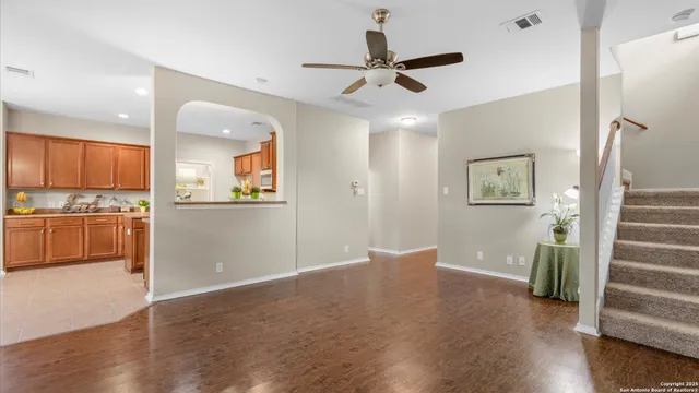 a view of a kitchen with a sink and a refrigerator