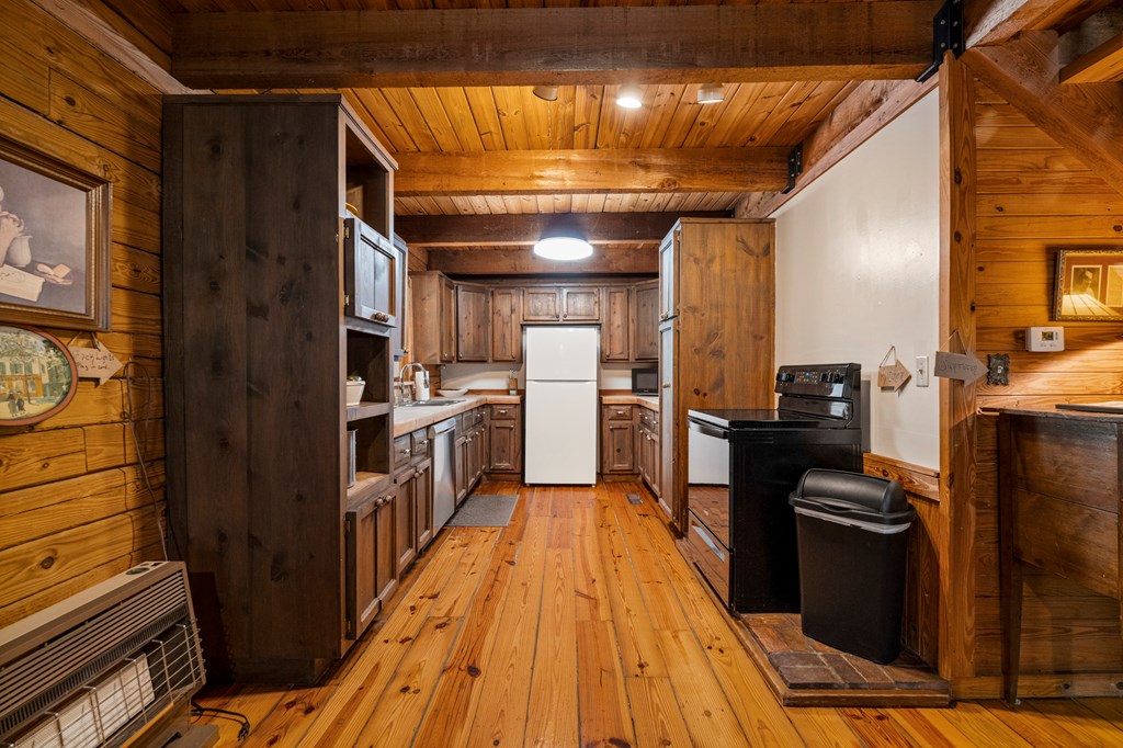299 South L Street Hamilton, GA 31811 - Photo 13 of 36 a kitchen with cabinets and wooden floor