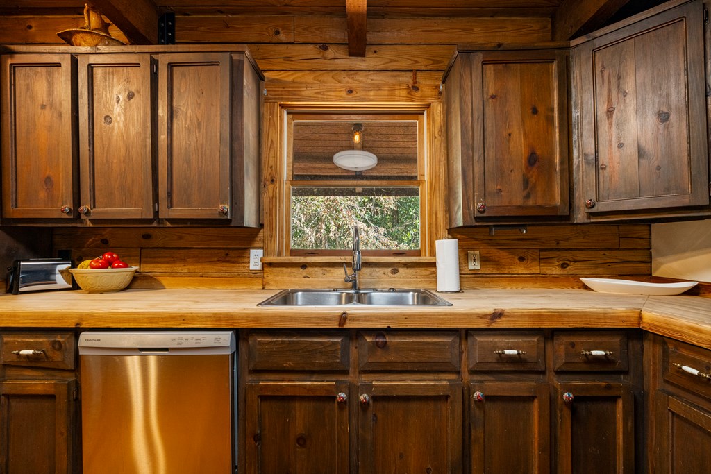 299 South L Street Hamilton, GA 31811 - Photo 14 of 36 a kitchen with a sink and cabinets