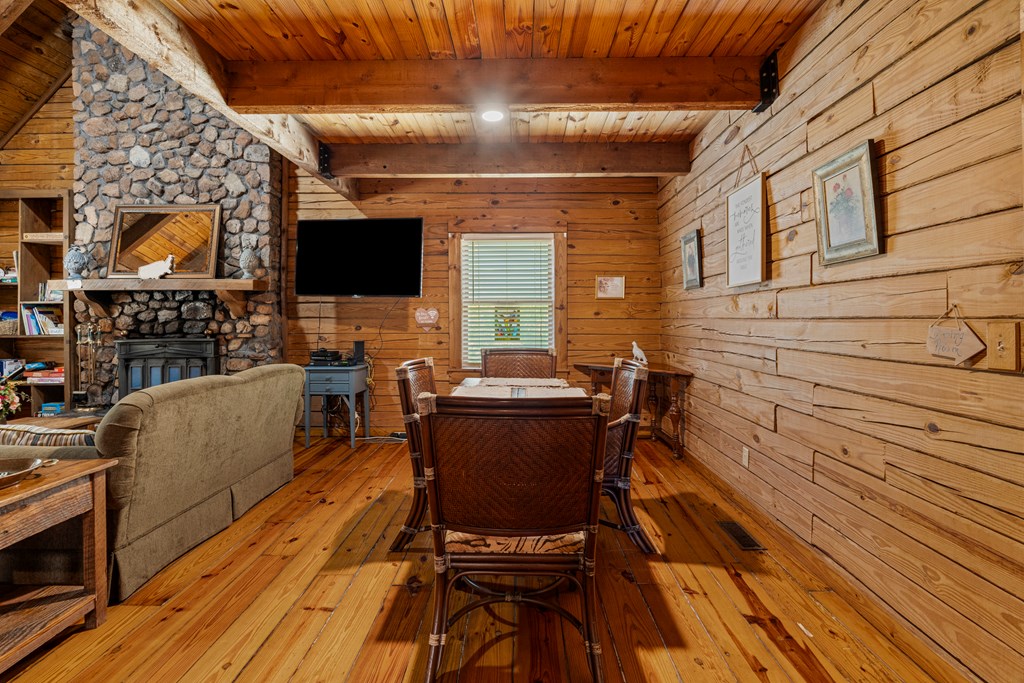 299 South L Street Hamilton, GA 31811 - Photo 5 of 36 a view of a patio with table and chairs with wooden floor and fence