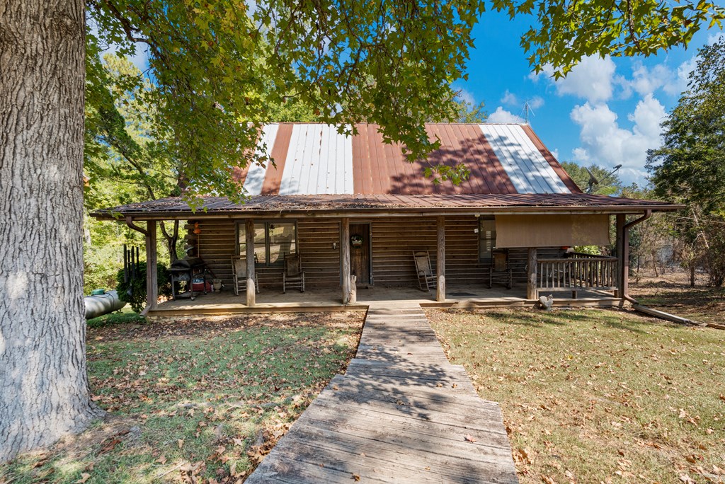 299 South L Street Hamilton, GA 31811 - Photo 9 of 36 front view of a house with a tree in front of it