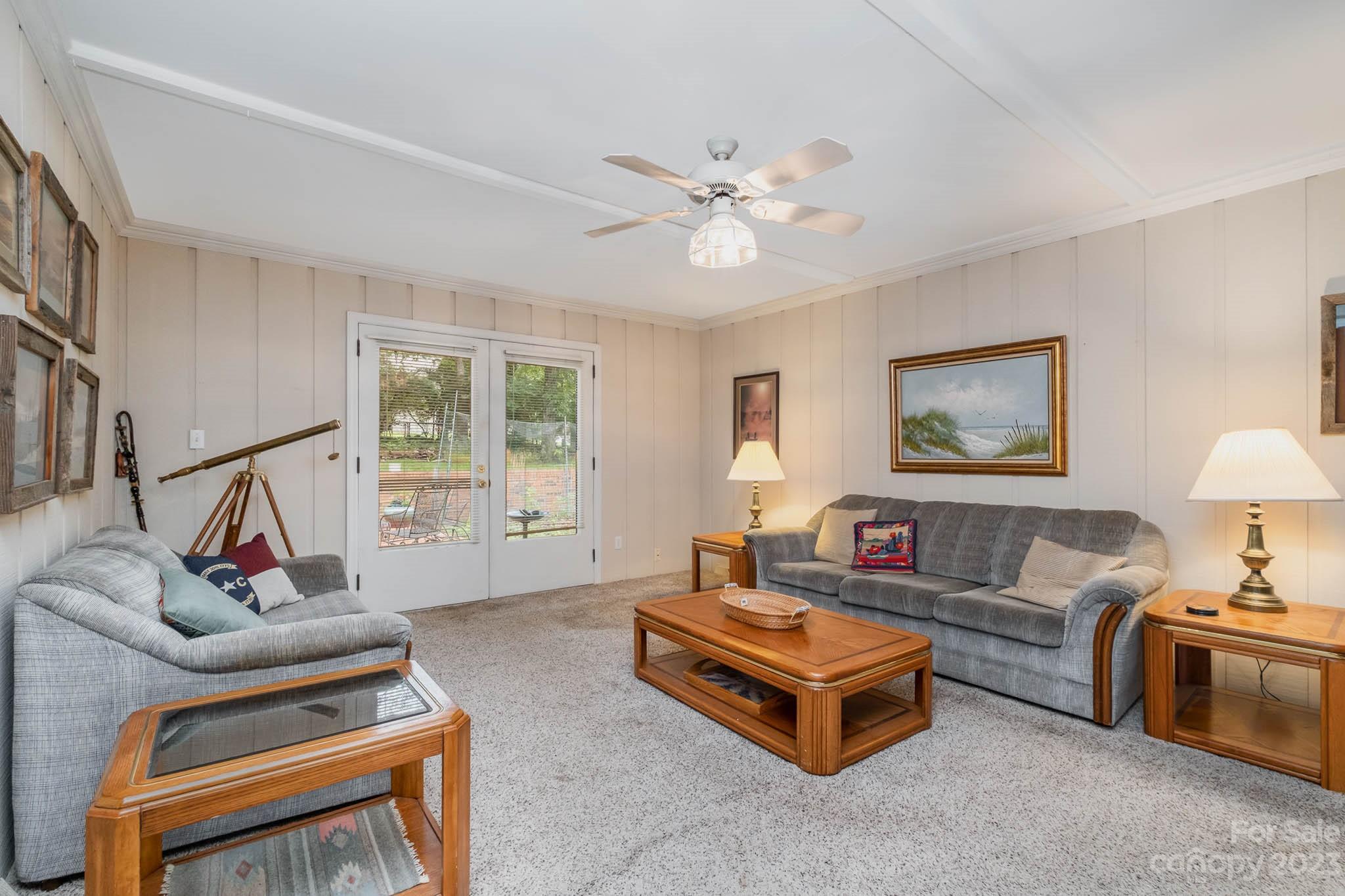 5901 Gate Post Road Charlotte, NC 28211 - Photo 13 of 41 a living room with furniture a couch and a window
