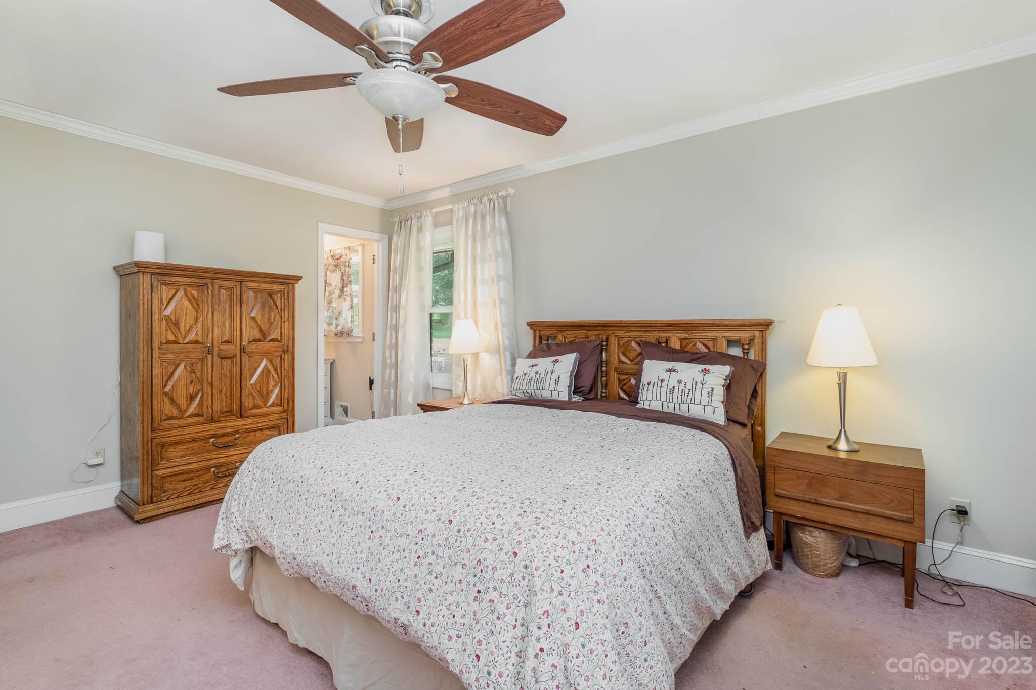 5901 Gate Post Road Charlotte, NC 28211 - Photo 18 of 41 a spacious bedroom with a bed and a lamp