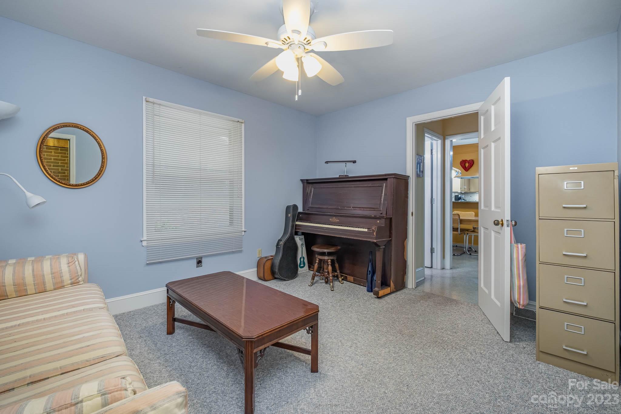 5901 Gate Post Road Charlotte, NC 28211 - Photo 27 of 41 a living room with furniture and a piano