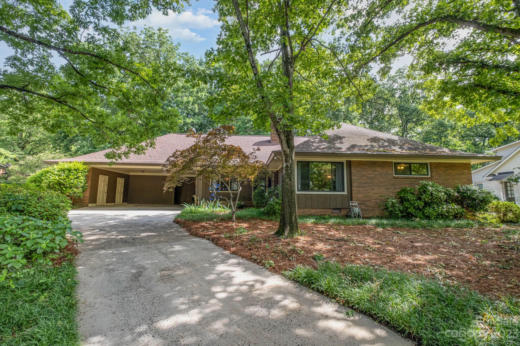 5901 Gate Post Road Charlotte, NC 28211 - Photo 39 of 41 a view of a house with a yard and potted plants