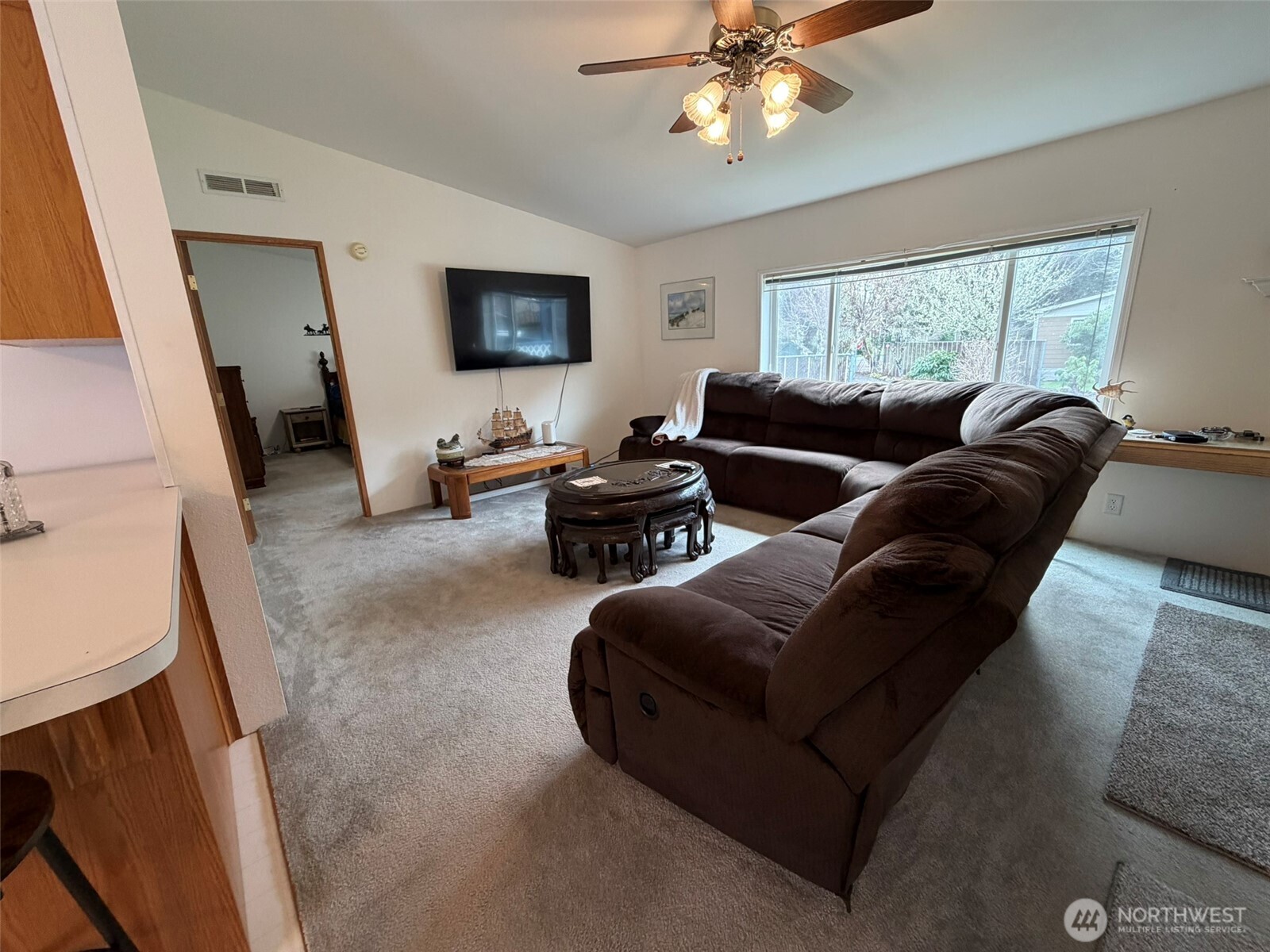 17 Rustemeyer Road, Unit 19 Aberdeen, WA 98520 - Photo 6 of 39 a living room with furniture and a flat screen tv