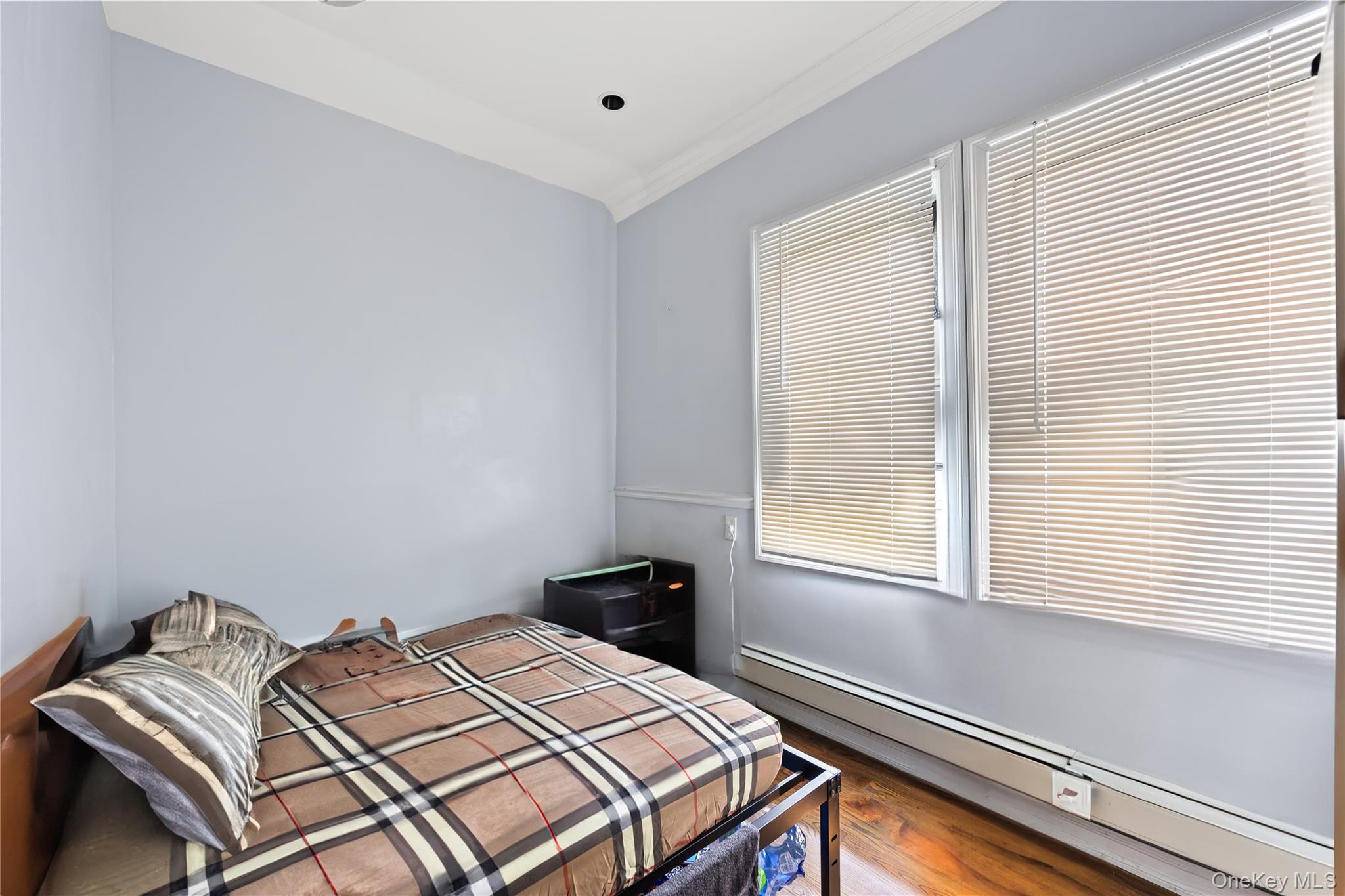 4114 Wickham Avenue Bronx, NY 10466 - Photo 13 of 27 a bedroom with a bed and a window