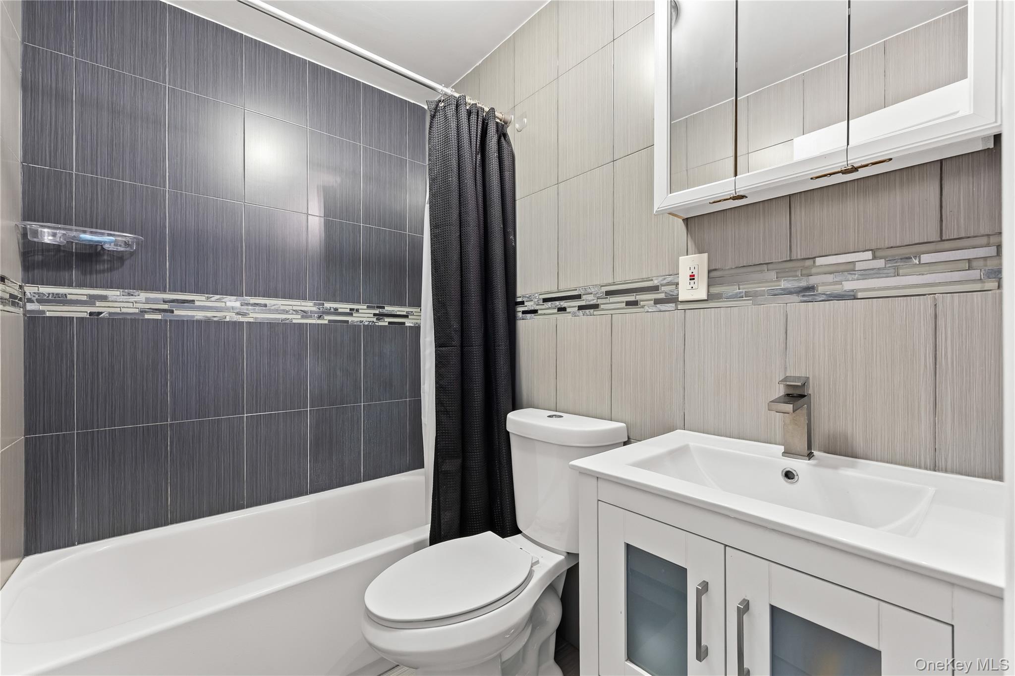 4114 Wickham Avenue Bronx, NY 10466 - Photo 15 of 27 a bathroom with a sink a toilet and shower